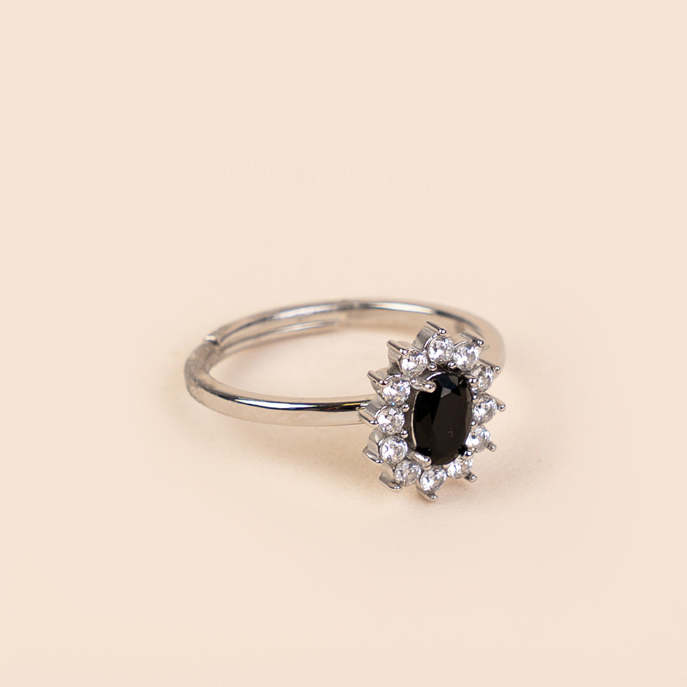 ADJUSTABLE RING WITH RHINESTONE-SURROUNDED LIGHT POINT