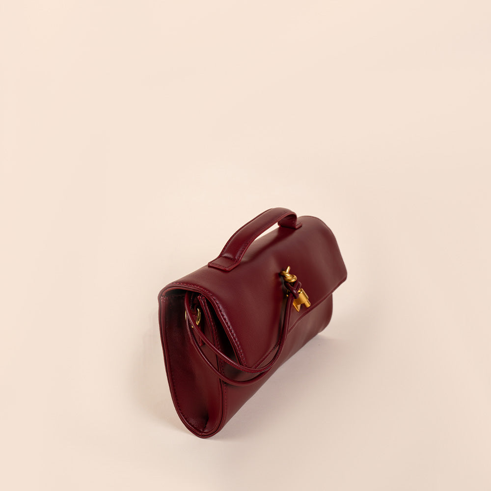 BORSA CLUTCH A MANO CON LACCIO SU CHIUSURA E TRACOLLA