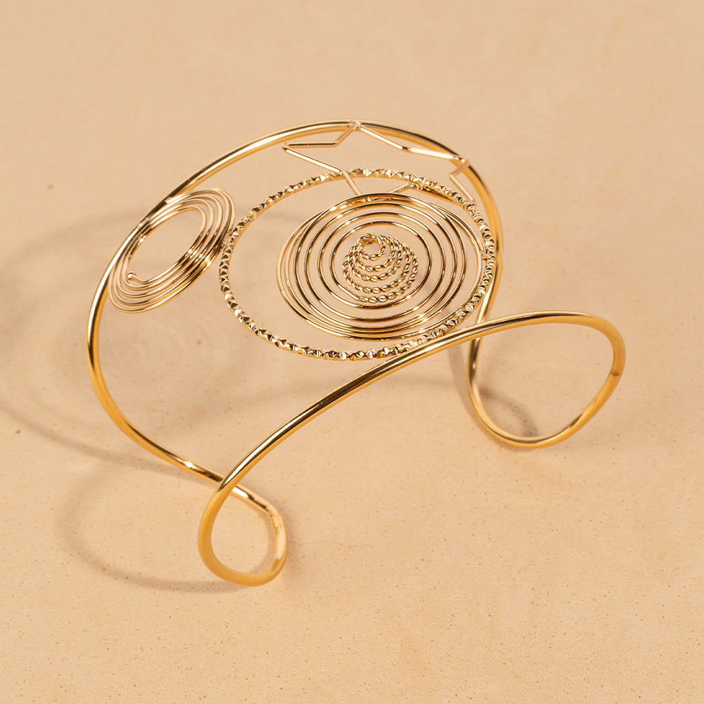 BRACCIALE RIGIDO A FASCIA CON SPIRALI E UNA STELLA