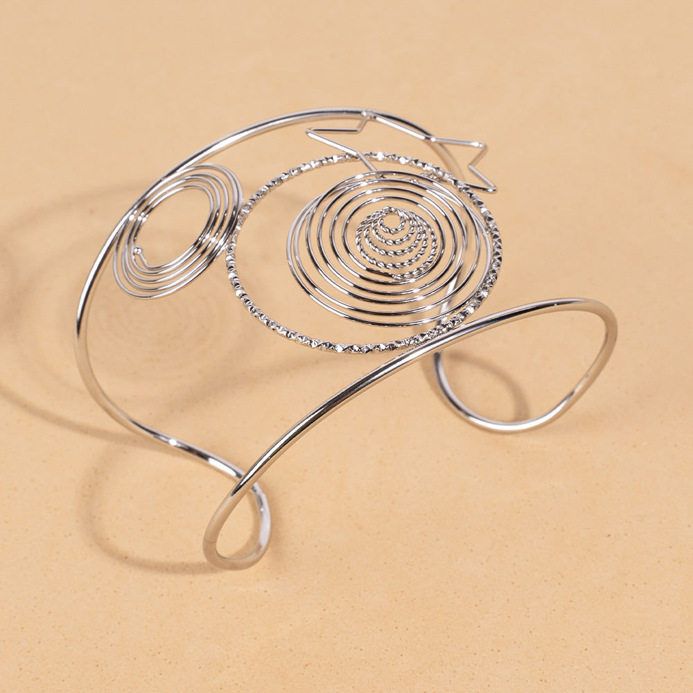 BRACCIALE RIGIDO A FASCIA CON SPIRALI E UNA STELLA