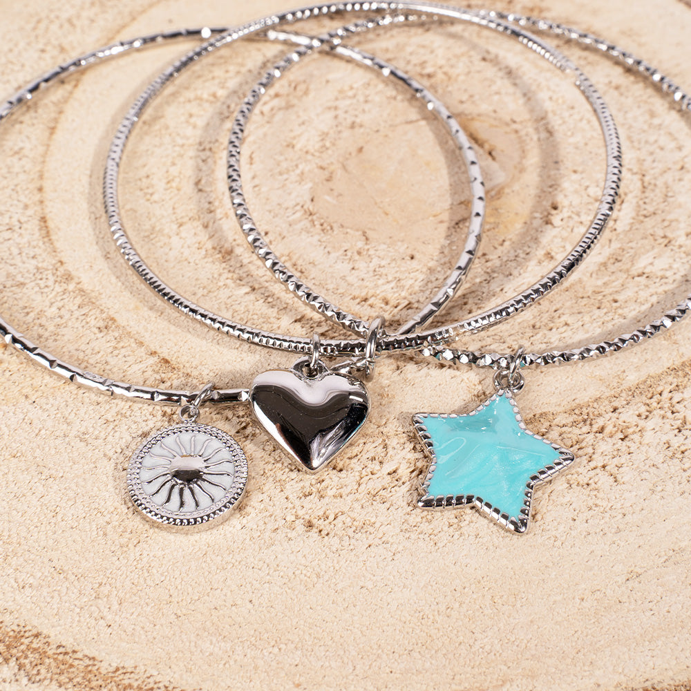 BRACCIALE RIGIDO CON CUORE, STELLA E SOLE PENDENTE