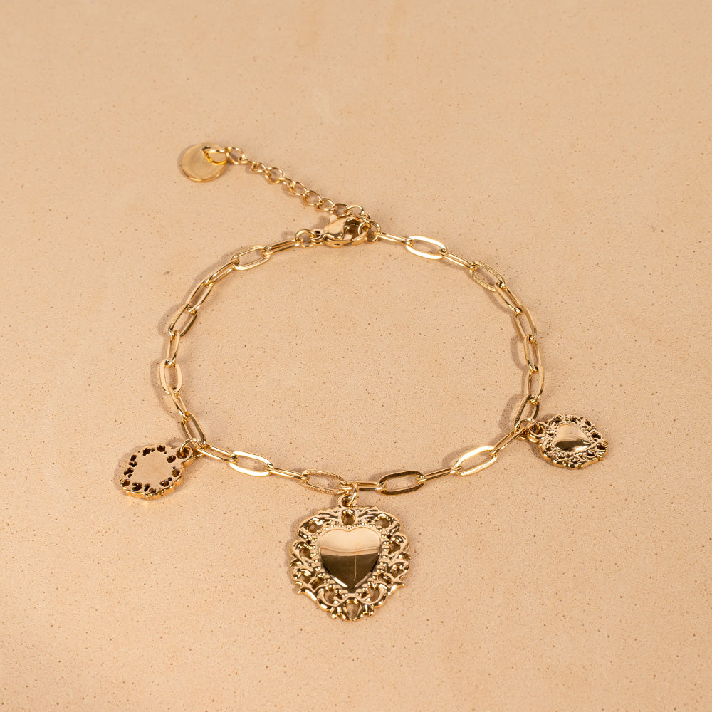 BRACCIALE MORBIDO CON TRE CUORI SACRI PENDENTI