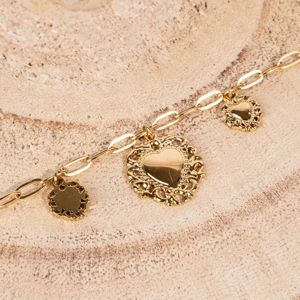 BRACCIALE MORBIDO CON TRE CUORI SACRI PENDENTI