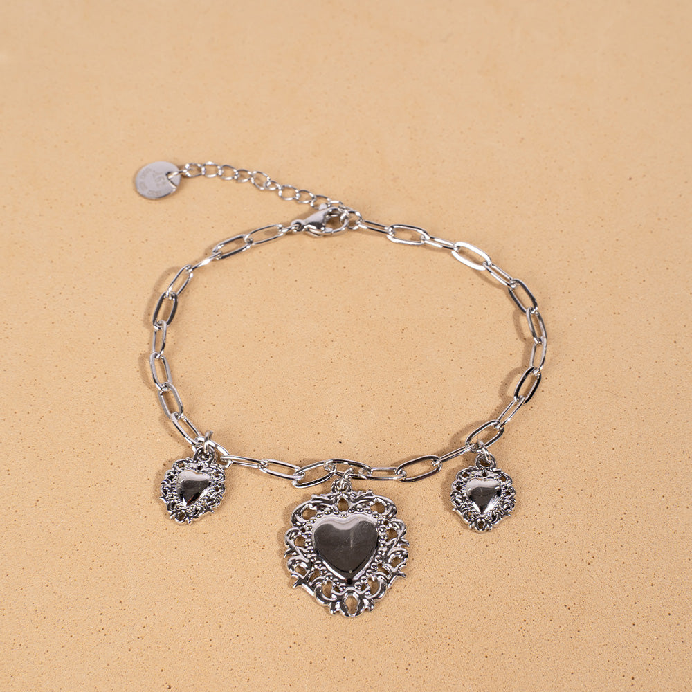 BRACCIALE MORBIDO CON TRE CUORI SACRI PENDENTI