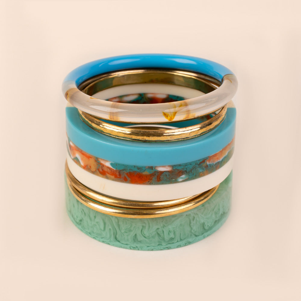 BRACCIALE RIGIDO COMPOSTO DA PIU' PEZZI IN DIVERSI COLORI E MATERIALI