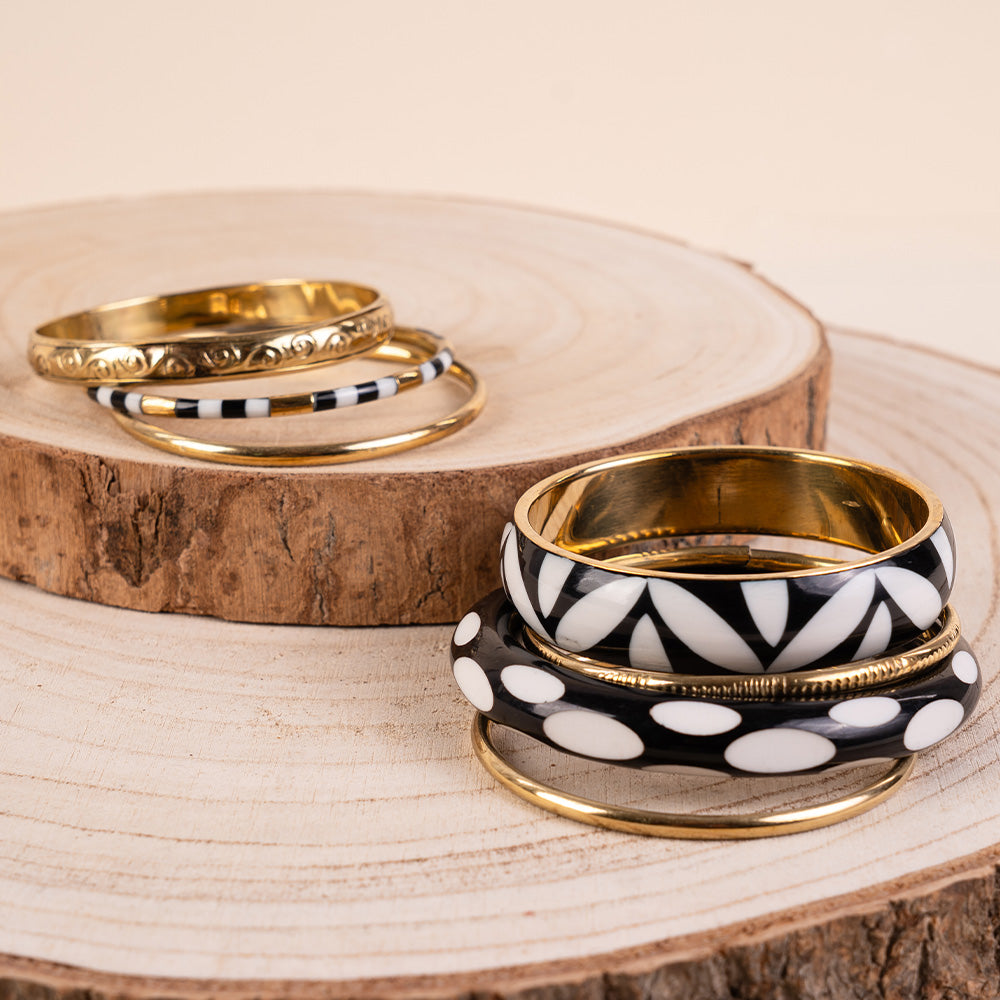 BRACCIALE RIGIDO COMPOSTO DA PIU' PEZZI IN DIVERSI  MATERIALI