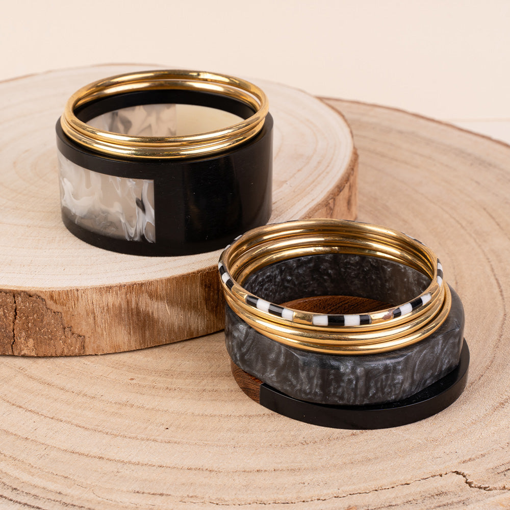 BRACCIALE RIGIDO COMPOSTO DA PIU' PEZZI IN DIVERSI  MATERIALI E COLORI