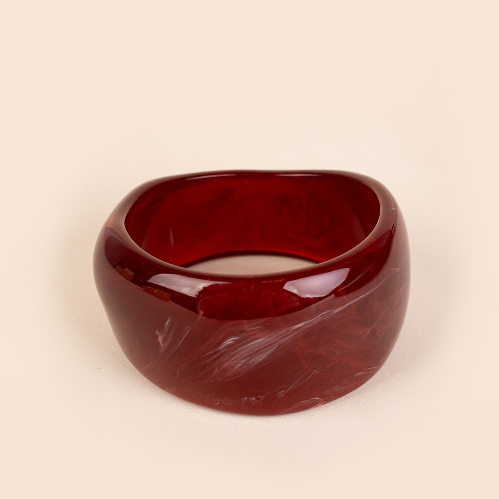 BRACCIALE RIGIDO ASIMMETRICO IN RESINA COLORATA