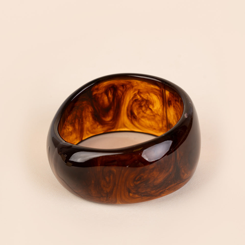 BRACCIALE RIGIDO ASIMMETRICO IN RESINA COLORATA