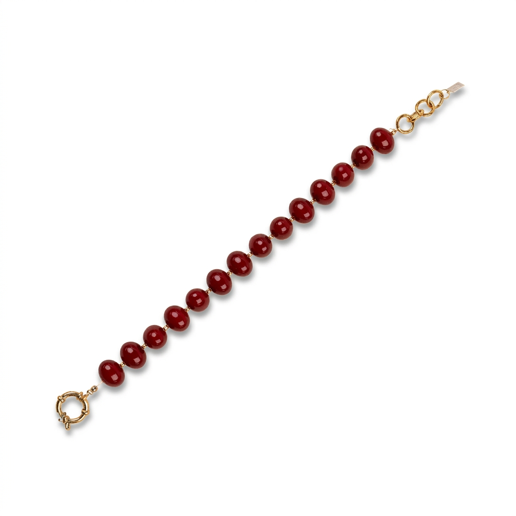 BRACCIALE CON PERLE OVALI LUCIDE INTERVALLATE DA PUNTI DORATI