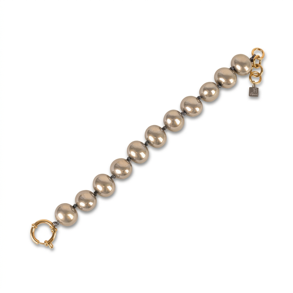 BRACCIALE CON PERLE OVALI LUCIDE INTERVALLATE DA NODINI