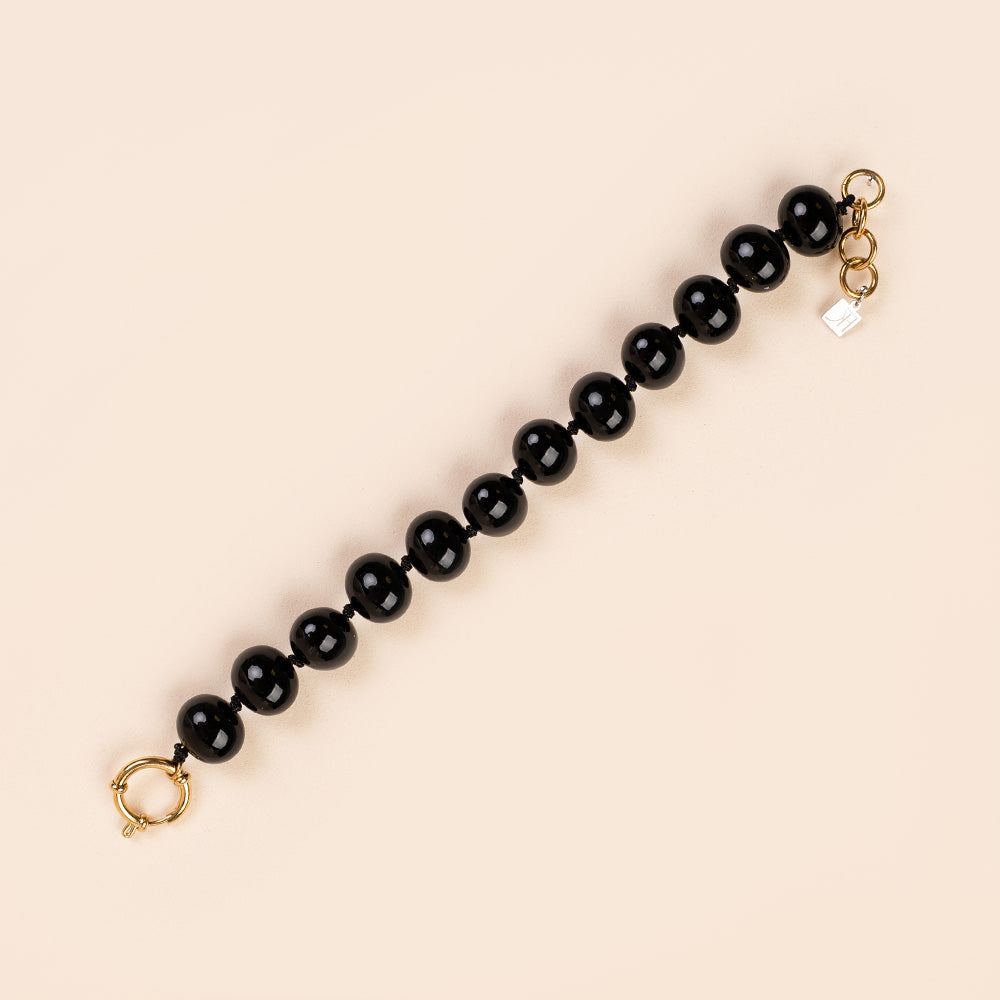 BRACCIALE CON PERLE OVALI LUCIDE INTERVALLATE DA NODINI