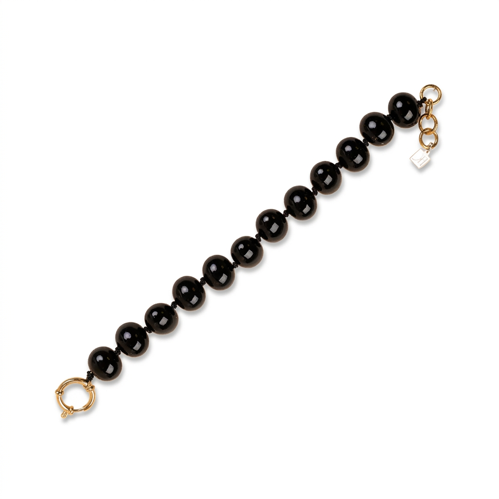 BRACCIALE CON PERLE OVALI LUCIDE INTERVALLATE DA NODINI