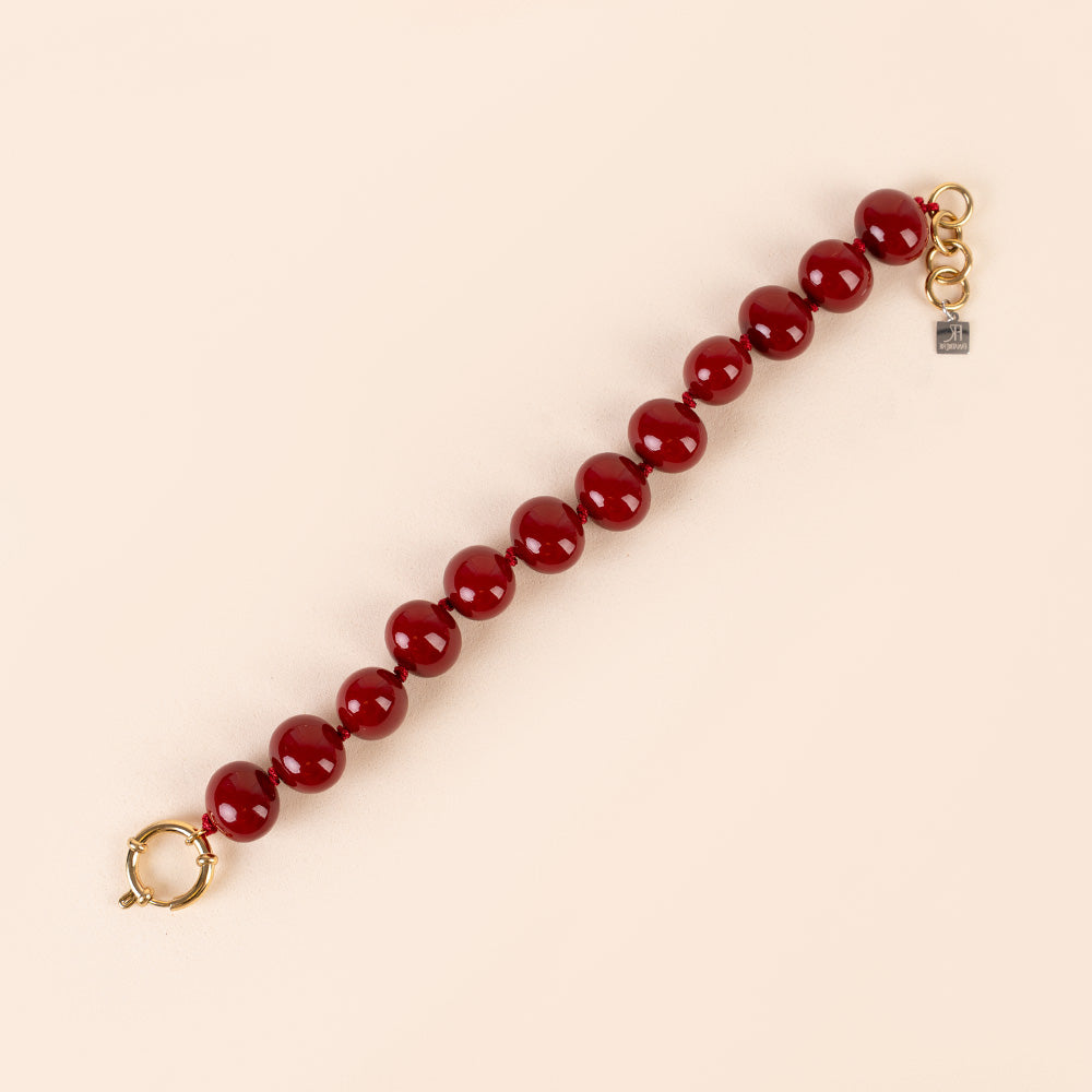 BRACCIALE CON PERLE OVALI LUCIDE INTERVALLATE DA NODINI