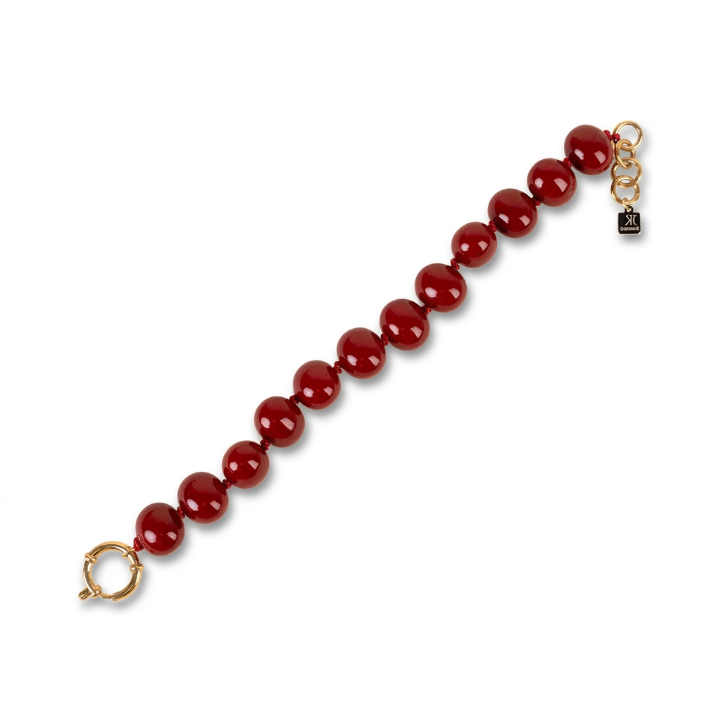 BRACCIALE CON PERLE OVALI LUCIDE INTERVALLATE DA NODINI