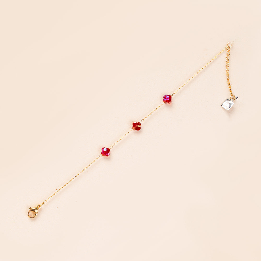 BRACCIALE A CATENA SOTTILE CON TRE PERLINE A FIORE