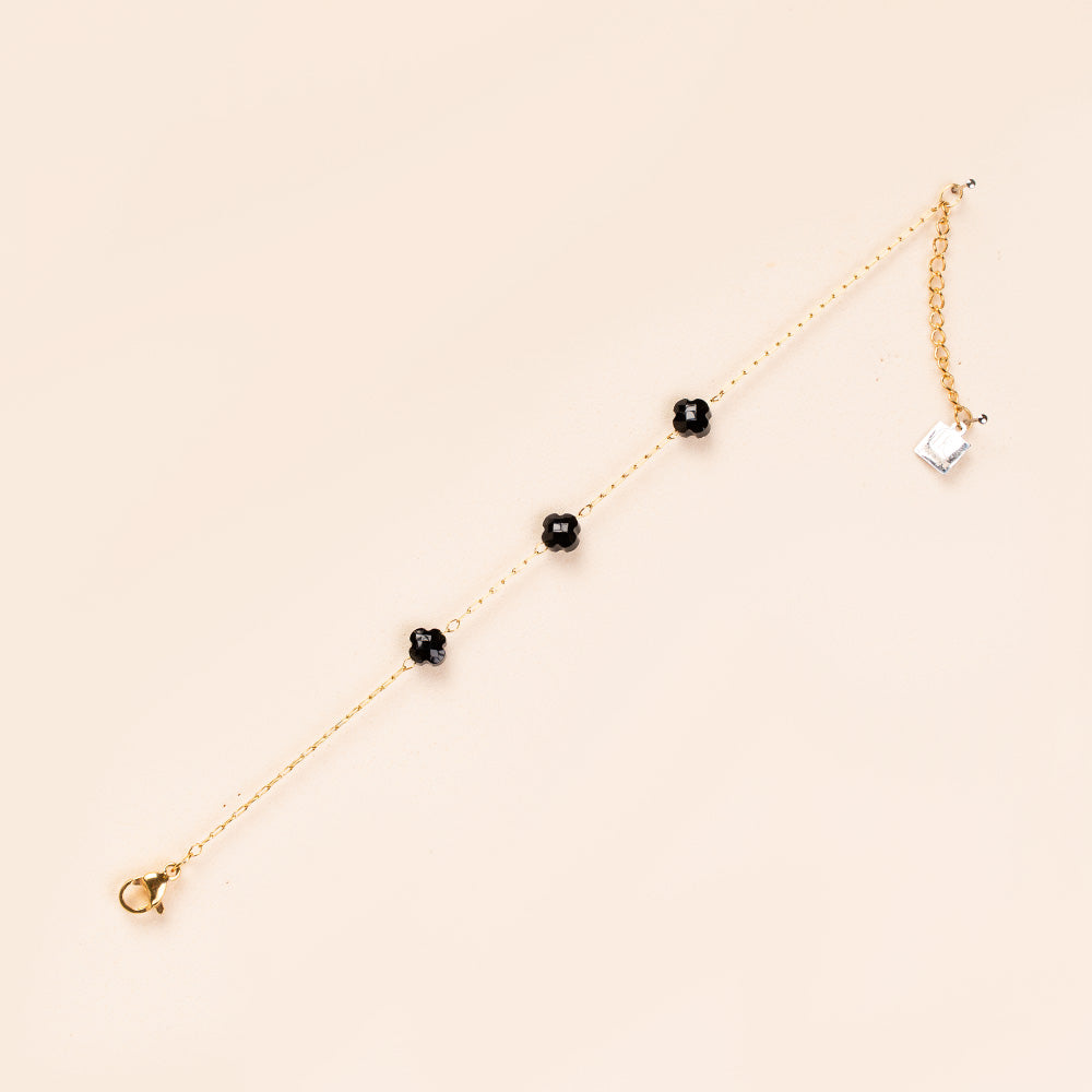 BRACCIALE A CATENA SOTTILE CON TRE PERLINE A FIORE