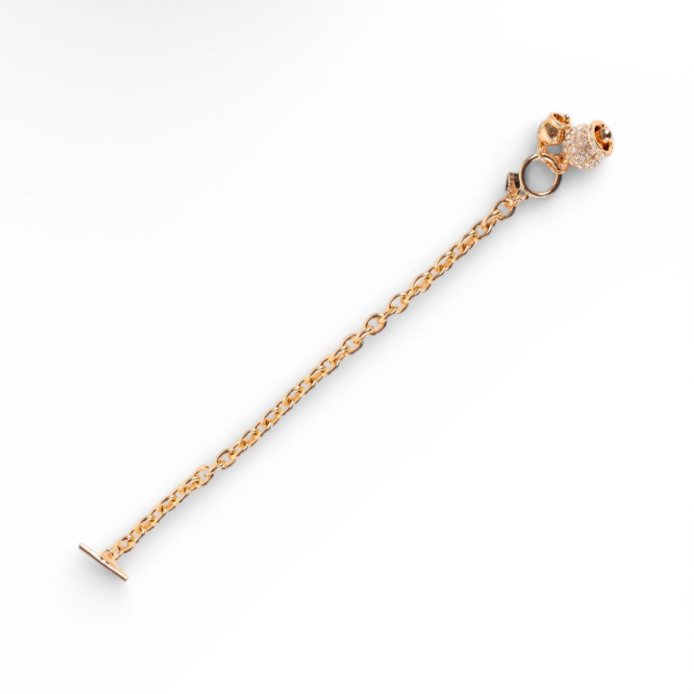 BRACCIALE CON CAMPANELLA PENDENTE RICOPERTA DI STRASS E CHIUSURA A T