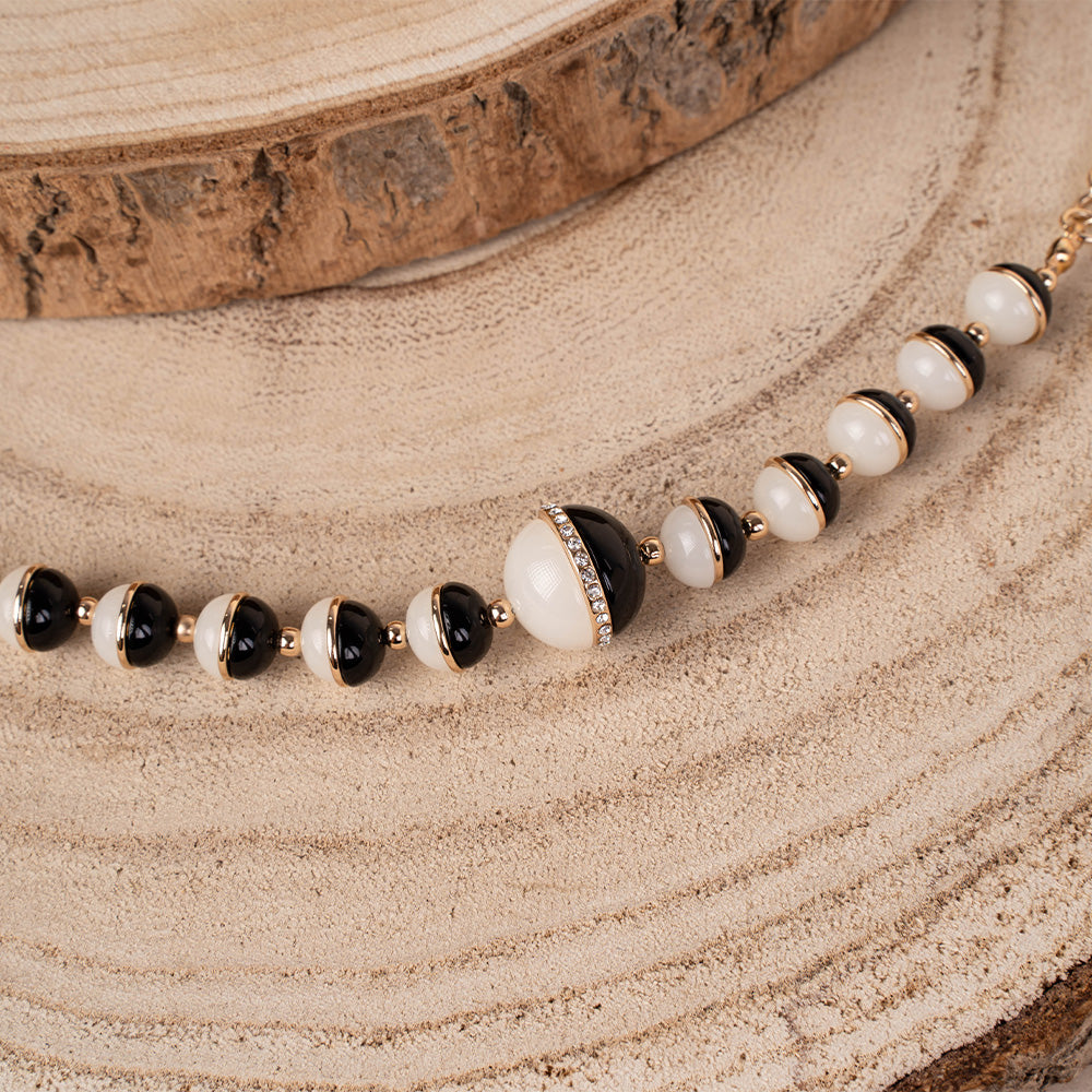 BRACCIALE CON SFERE DIVISE A META'