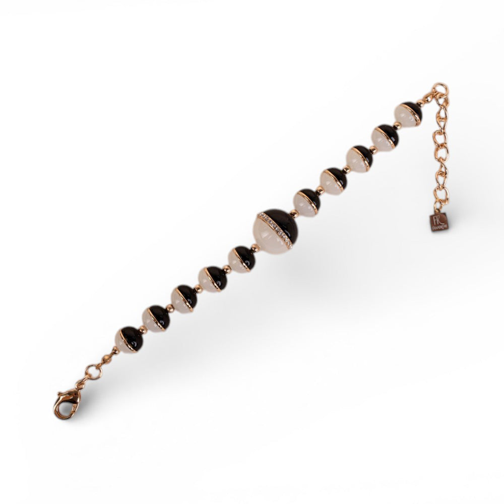 BRACCIALE CON SFERE DIVISE A META'