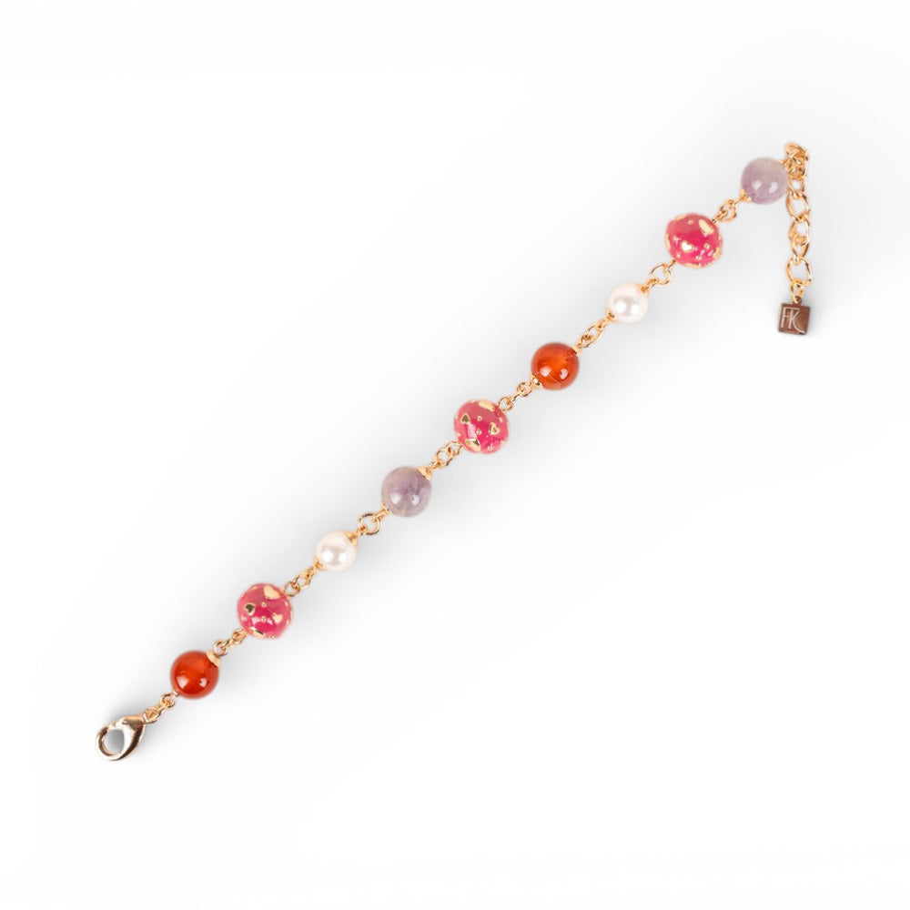BRACCIALE CON PIETRE E SFERE CON CUORI