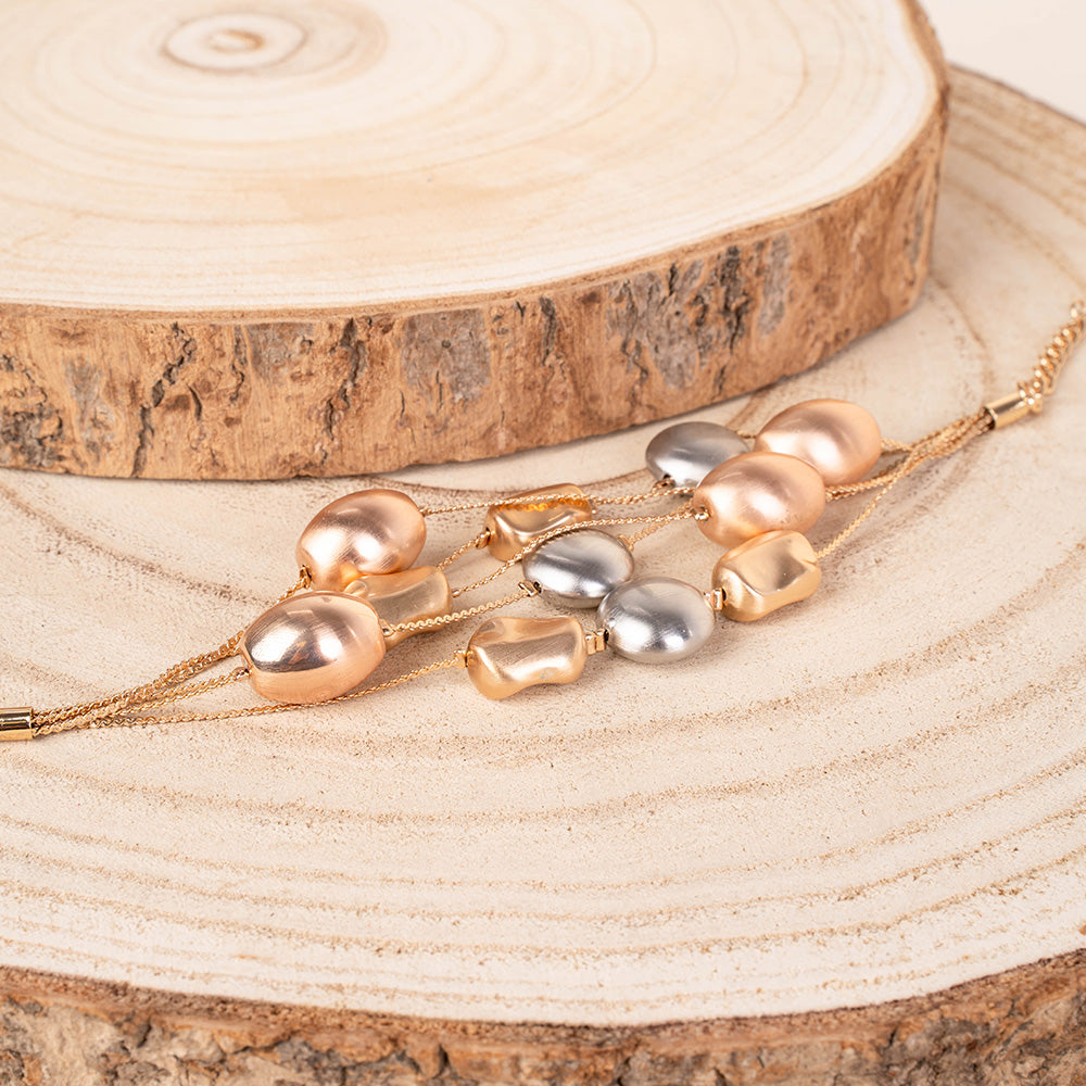 BRACCIALE MULTIFILO CON ELEMENTI SATINATI ASIMMETRICI