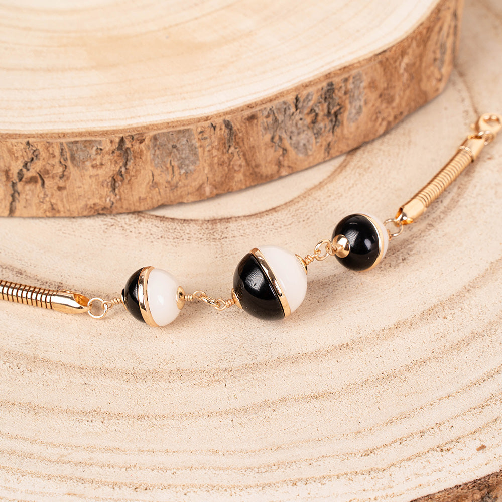 BRACCIALE CON TUBULARE E TRE SFERE DIVISE A META'