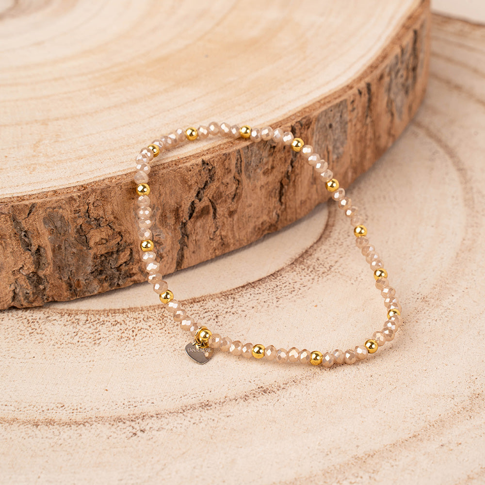 BRACCIALE ELASTICO CON CRISTALLI SFACCETTATI E SFERE