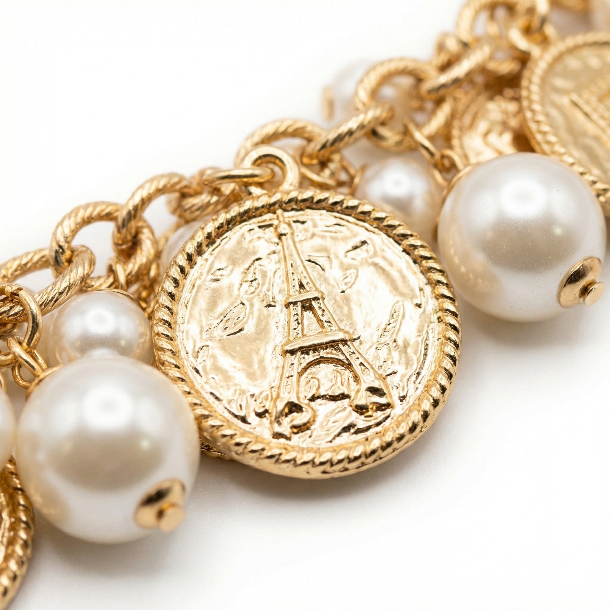 BRACCIALE MORBIDO CON MONETE E PERLE PENDENTI