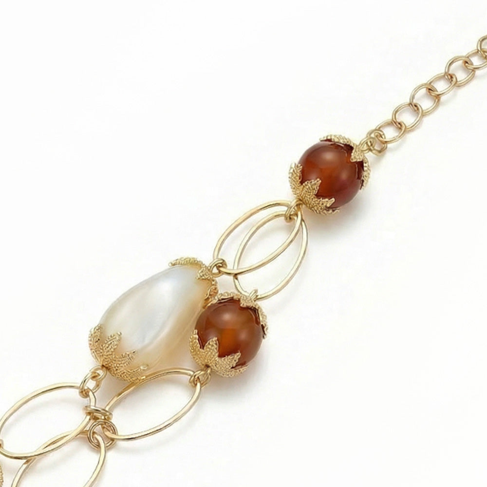 BRACCIALE A DUE FILI CON DICHI PERLE OVALI E SFERE SFUMATE