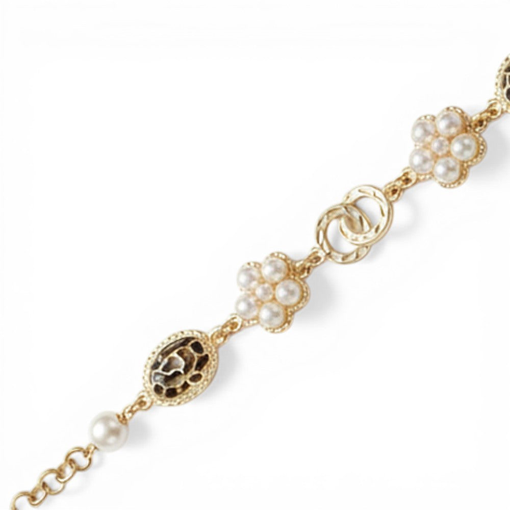 BRACCIALE CON ELEMENTI A FIORE E OVALI