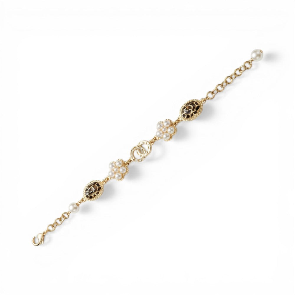 BRACCIALE CON ELEMENTI A FIORE E OVALI