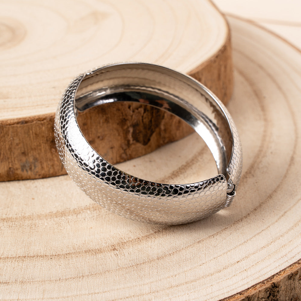 BRACCIALE RIGIDO A FASCIA CON CHIUSURA A MOLLA