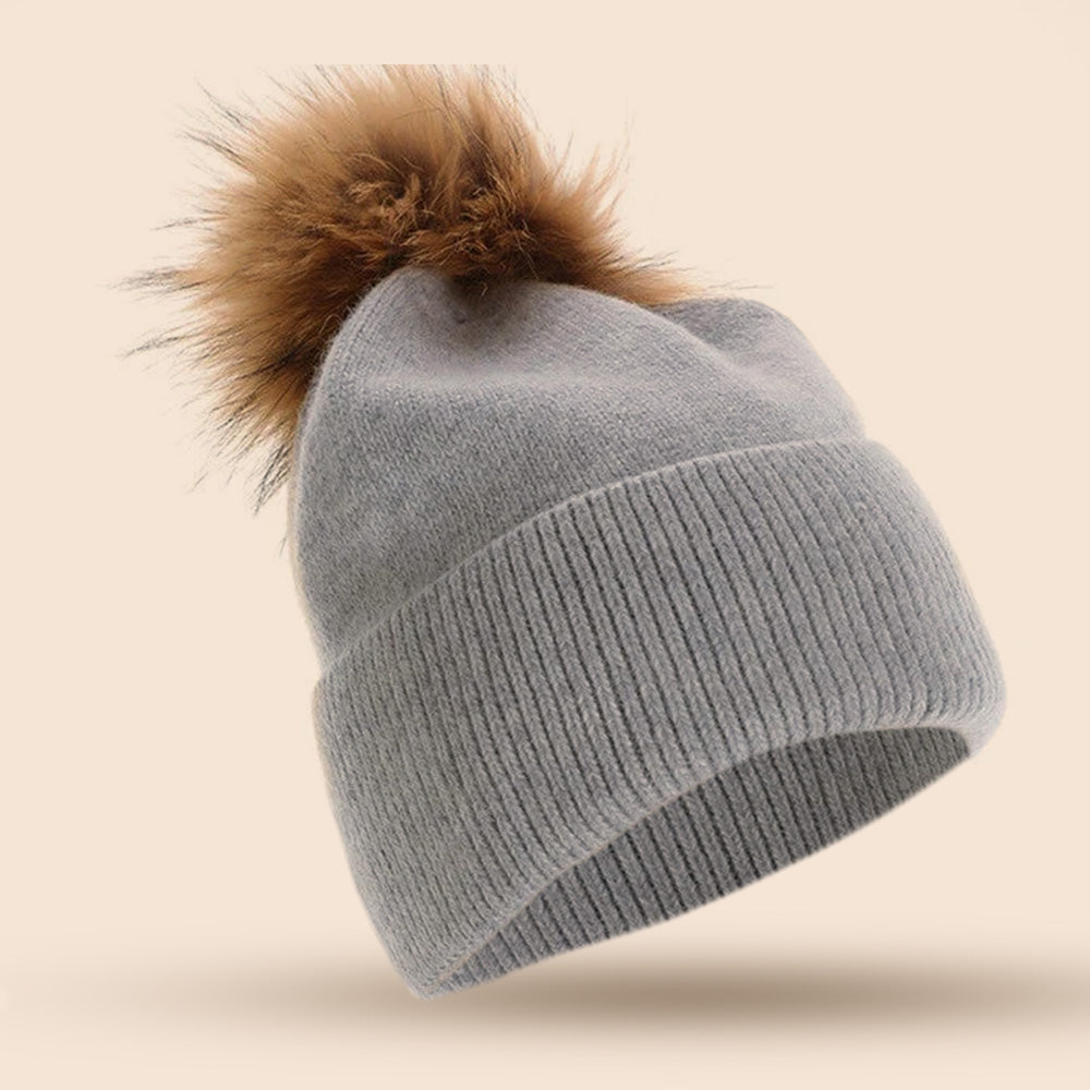 CAPPELLO A CUFFIA CON PON PON IN PELLICCIA