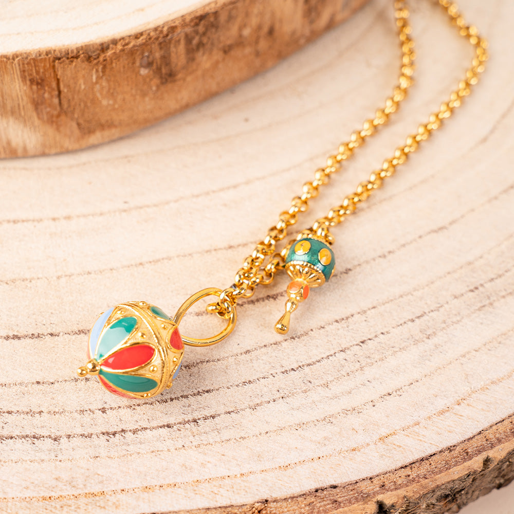 LONG NECKLACE WITH SPINNING TOP PENDANT