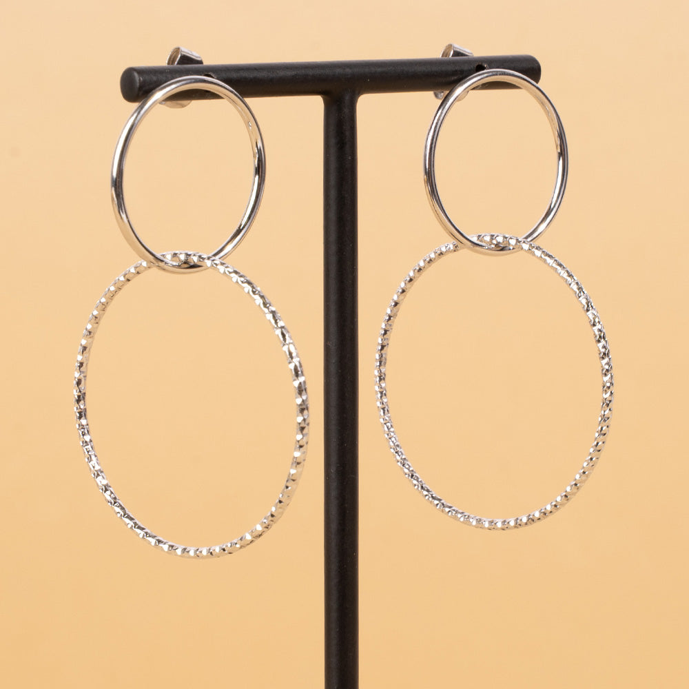 DANGLING EARRINGS WITH DOUBLE HOOP, ONE OF WHICH IS WORKED
