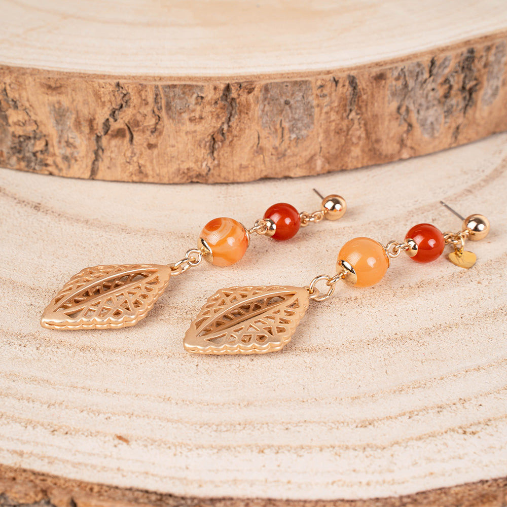 ORECCHINI PENDENTI CON SFERE E ELEMENTO TRAFORATO