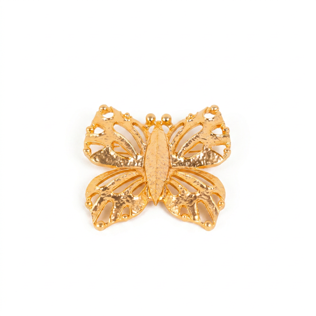 LARGE CARVED AND HAMMERED BUTTERFLY BROOCH
