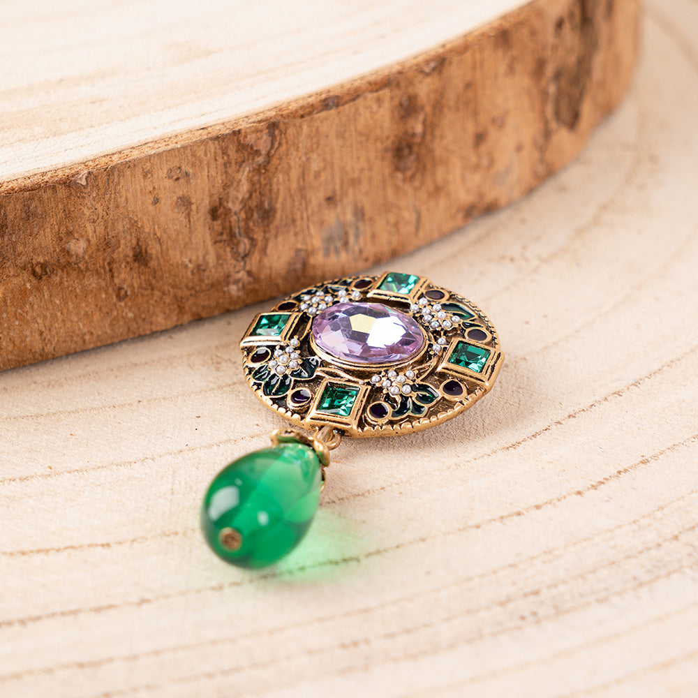 FLOWER BROOCH WITH CARVED ROSETTE AND VERTICAL PENDANT