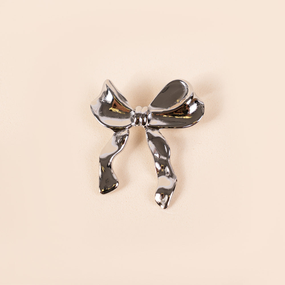 ASYMMETRIC BOW BROOCH